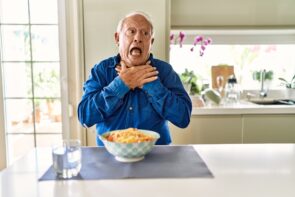 Senior,Man,With,Grey,Hair,Eating,Pasta,Spaghetti,At,Home